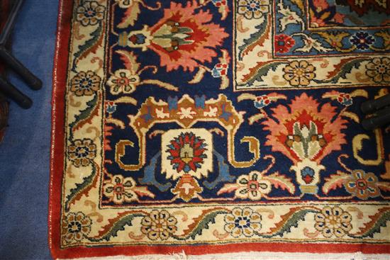 A Heriz ivory and blue ground carpet, 13ft by 10ft